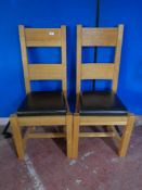 A pair of contemporary oak high backed dining chairs