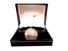 A gent's 9ct gold Everite quartz wristwatch on leather strap in box.