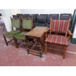 A continental oak armchair upholstered in a striped fabric together with a further pair of oak