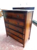 A 20th century oak five drawer chest