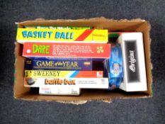 A box containing a quantity of vintage board games to include Game of the Year, The Sweeney,