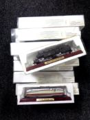 A tray of eleven die cast model trains in original packaging