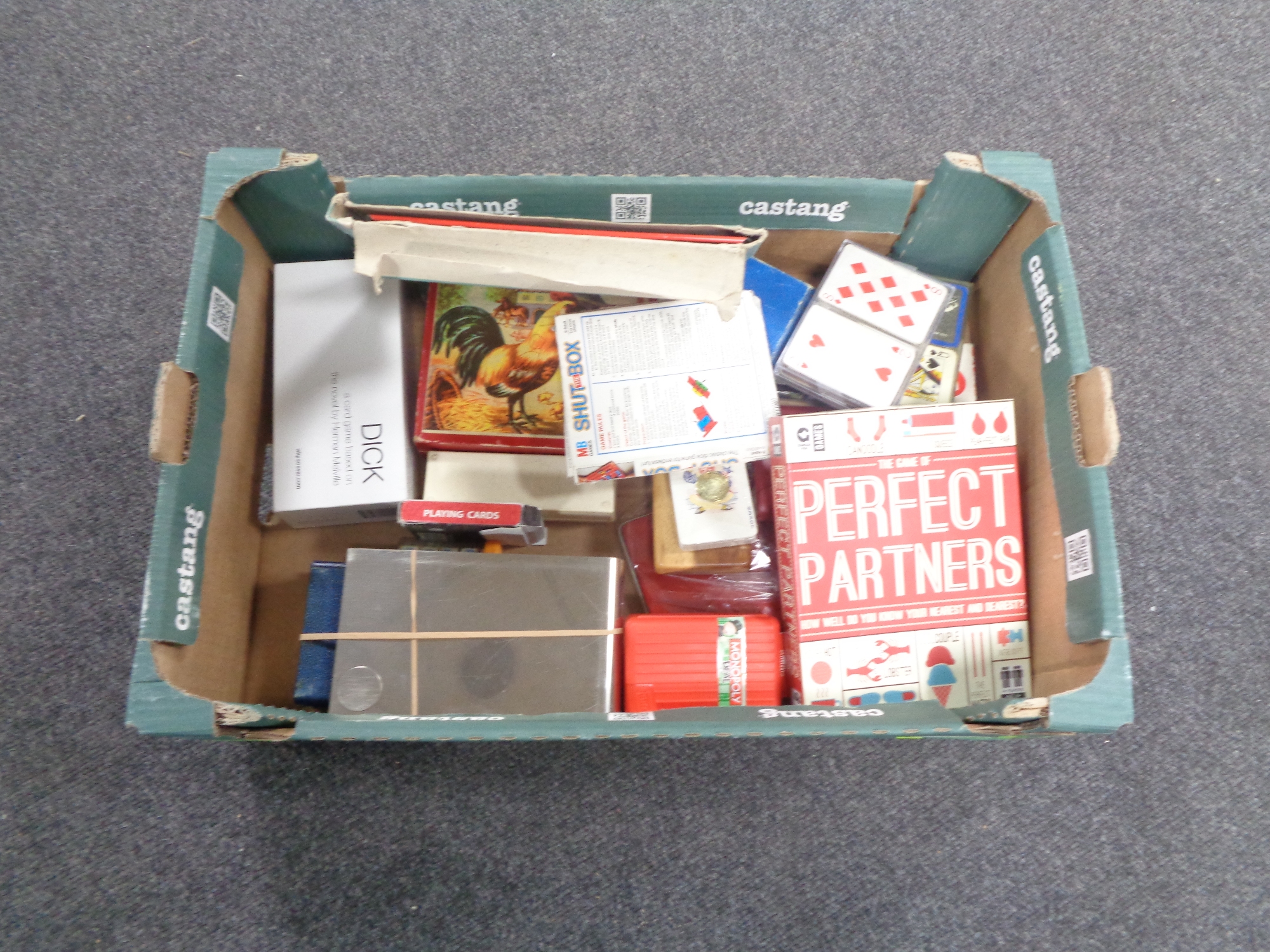 A box containing assorted games, playing cards etc.