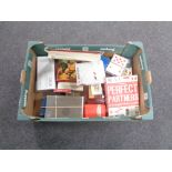 A box containing assorted games, playing cards etc.