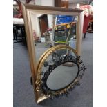 A wrought metal framed mirror together with two further gilt framed mirrors.