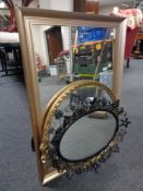 A wrought metal framed mirror together with two further gilt framed mirrors.