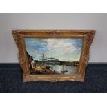 A gilt framed oil on board, boats in dock with bridge beyond, by J. E. Harker.