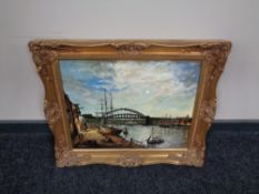 A gilt framed oil on board, boats in dock with bridge beyond, by J. E. Harker.