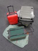 Three hard shell luggage cases together with a further luggage case,