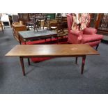 A mid 20th century Danish teak coffee table (adjustable height).