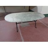 A marble effect coffee table on metal base