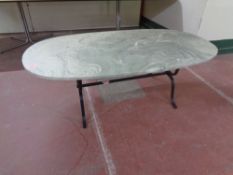 A marble effect coffee table on metal base