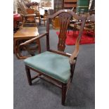 A 19th century oak Hepplewhite style armchair.