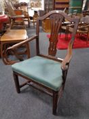 A 19th century oak Hepplewhite style armchair.