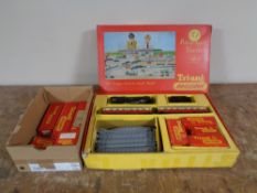 A boxed Triang Railways passenger train set OO gauge and a box of boxed accessories bogey wagon,