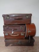 Four vintage leather luggage cases together with a leather hat box