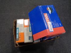 A box containing two boxed Black and Decker sanders, a boxed Duratool tile cutter,