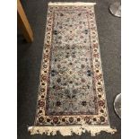 A Persian Nain rug on blue ground 184 x 78 cm