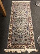 A Persian Nain rug on blue ground 184 x 78 cm