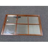 A mid 20th century teak framed sectional wall mirror.