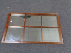 A mid 20th century teak framed sectional wall mirror.