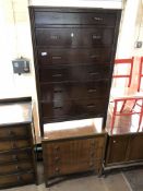 A 20th century oak five drawer chest together with a walnut three drawer chest
