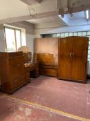 A four piece walnut Art Deco bedroom suite comprising of gent's wardrobe, linen chest,