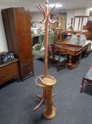 A painted Bentwood hat and coat stand together with a pine torchere.