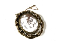 A Victorian mourning cameo brooch.