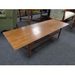 A mid 20th century teak rectangular coffee table with under shelf.