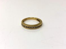 An 18ct gold half eternity ring, 3.