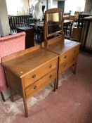 An Edwardian oak two drawer dressing chest with matching two drawer chest