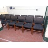 A set of twelve mid 20th century teak dining chairs upholstered in a striped fabric