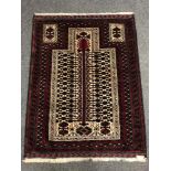 An Afghan prayer rug 131 x 100 cm