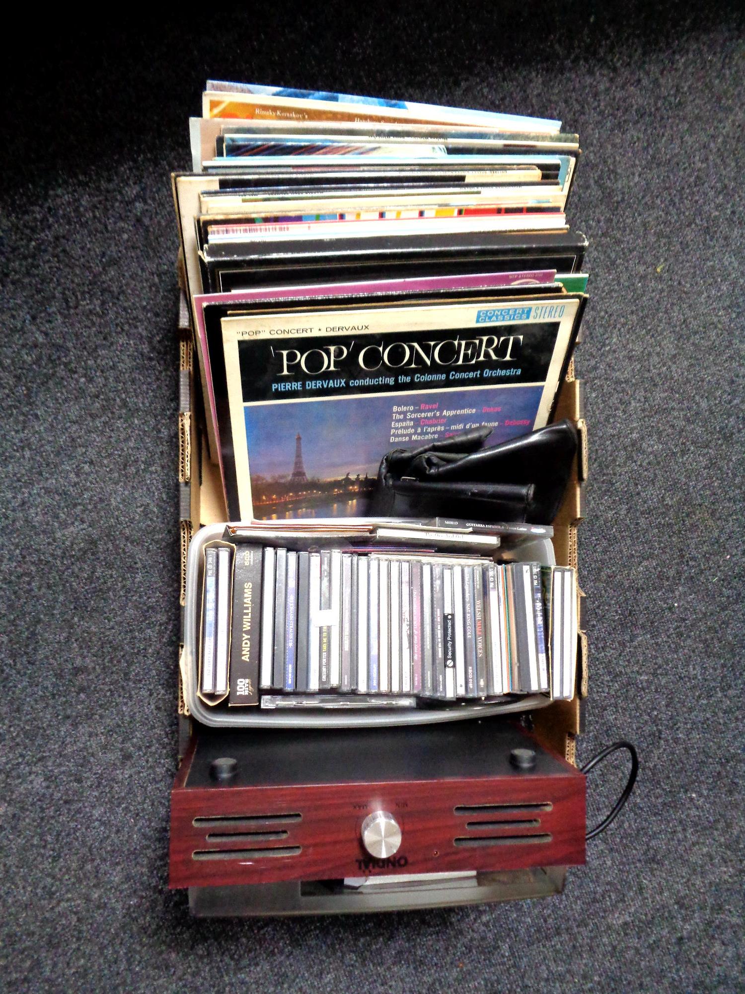 A box containing Ondial electric turntable together with a quantity of vinyl LPs and CDs (various).