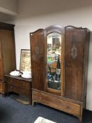 A 1930s oak mirror door wardrobe, fitted drawer beneath, together with two drawer chest,