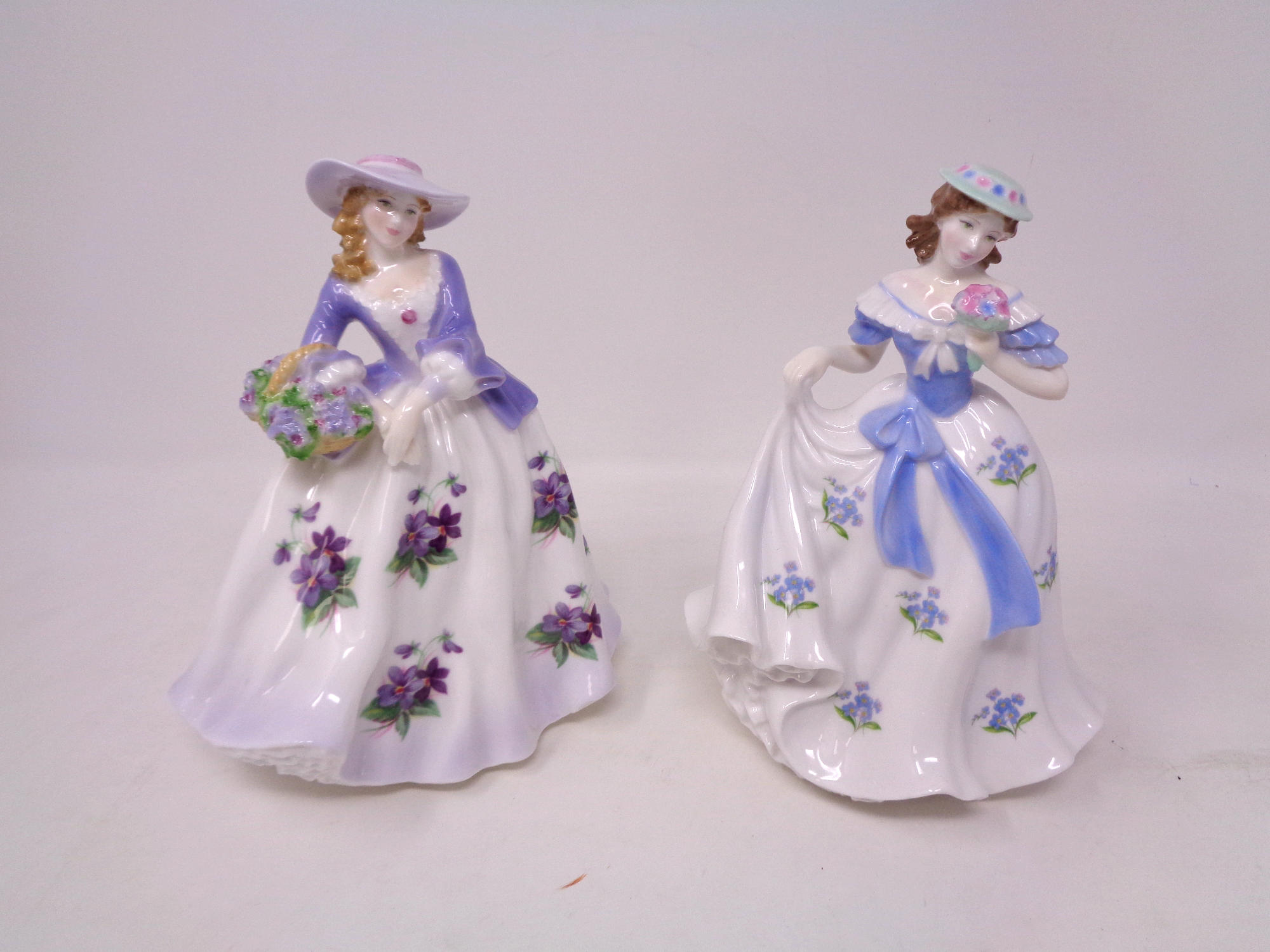 Two Royal Worcester figures, Sweet Forget Me Not No.1427 of 9500 and Sweet Violet No. 1427 of 9500.