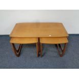 A nest of three 20th century Nathan teak tables.