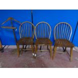 A set of three spindle back kitchen chairs together with a valet stand