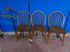 A set of three spindle back kitchen chairs together with a valet stand