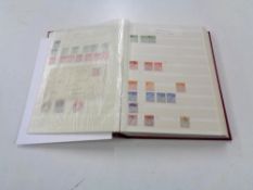 A stamp dealing album - GB Definitives, mixed quality used, lightly hinged mint and mint stamps.