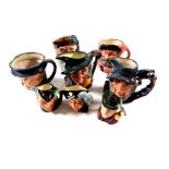 Eight small Royal Doulton character jugs to include Pied Piper, Rip Van Winkle, Falstaff,