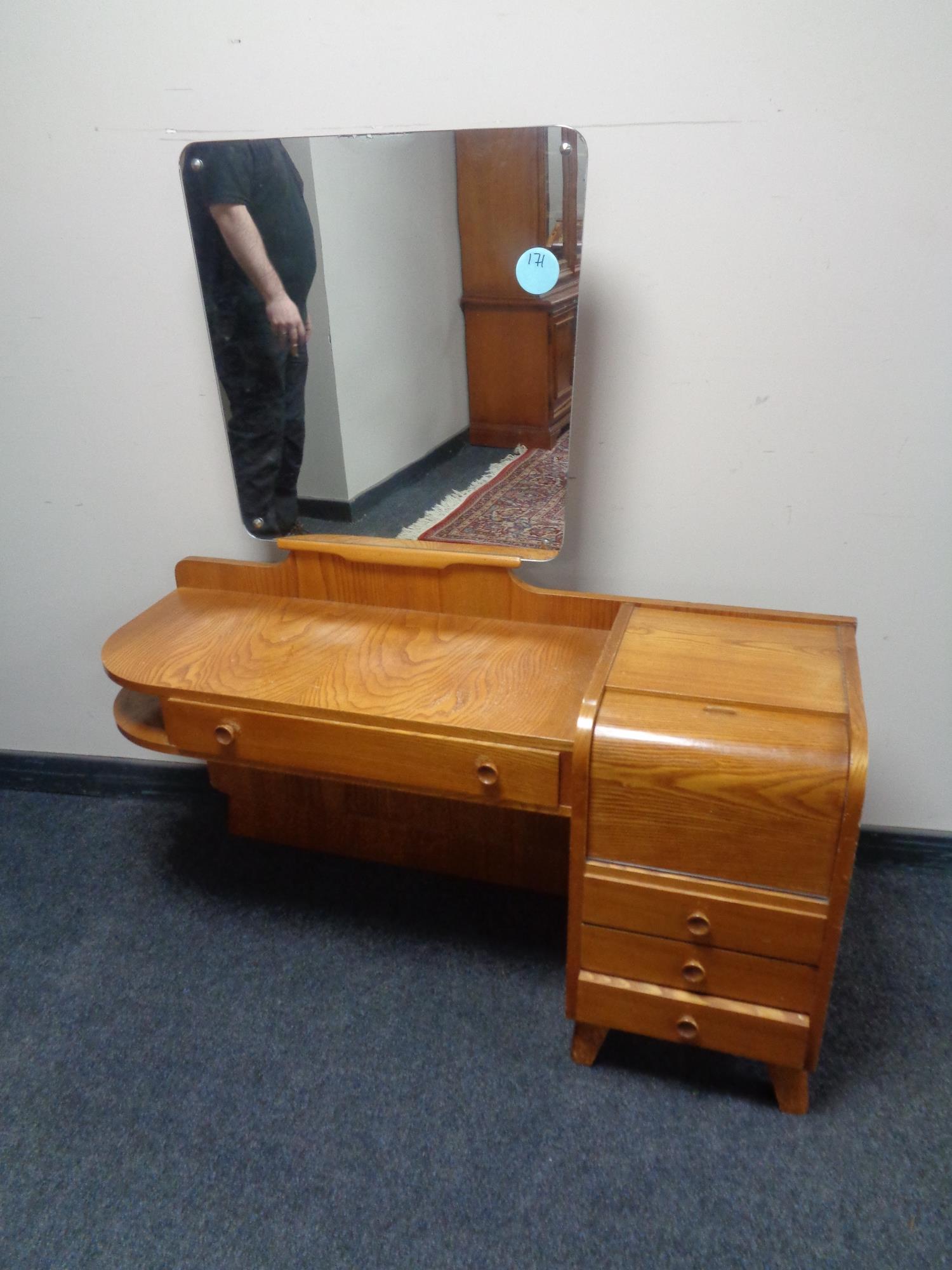 A 20th century Art Deco dressing table, fitted cabinet and four drawers.