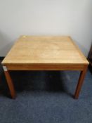 A mid 20th century Danish teak square coffee table.