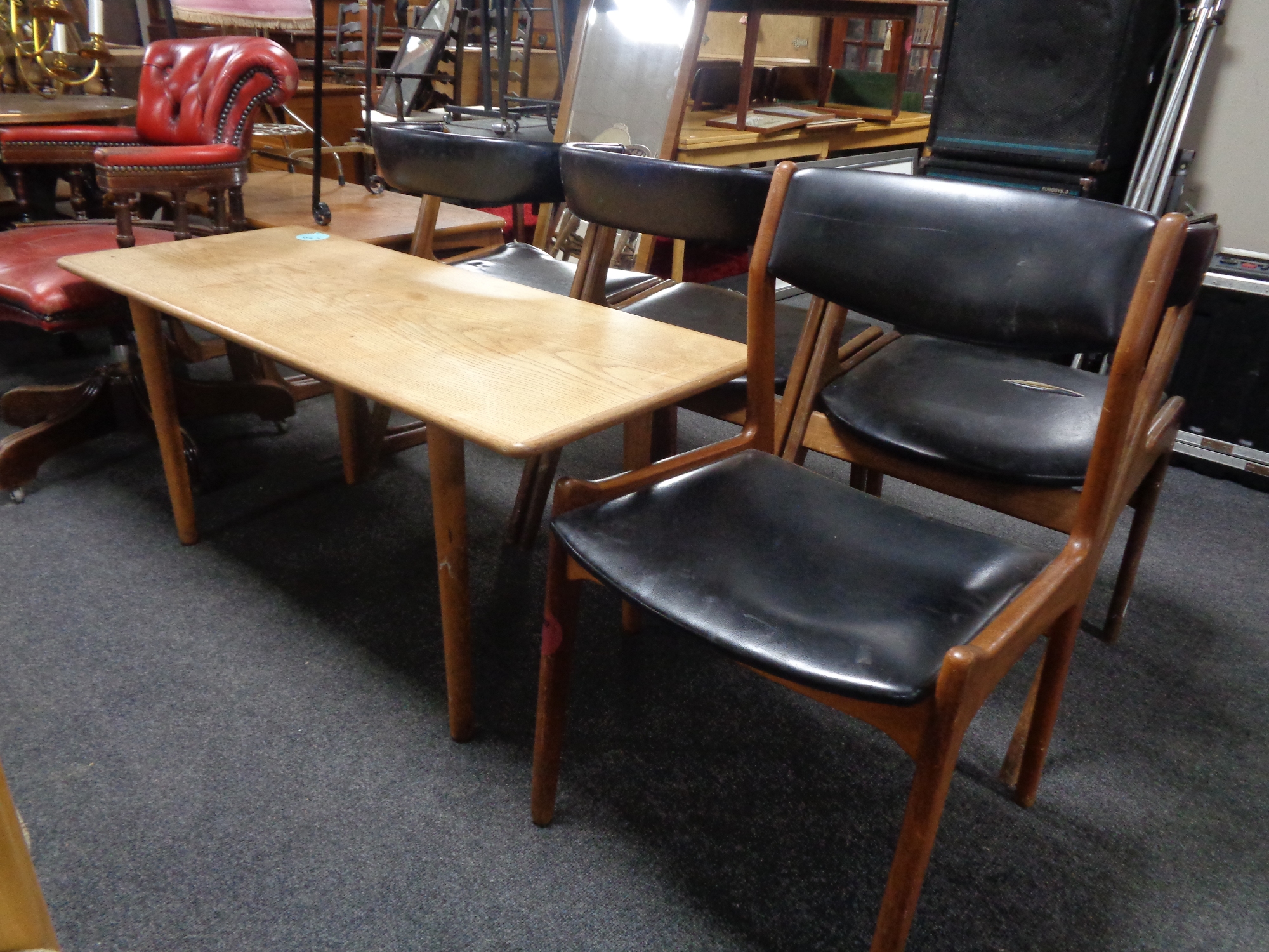 A mid 20th century teak coffee table together with a mid 20th century teak dining chair upholstered