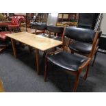 A mid 20th century teak coffee table together with a mid 20th century teak dining chair upholstered