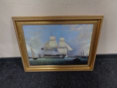 A pair of gilt framed prints on canvas depicting ships