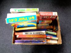 A box containing a quantity of vintage board games to include Supersell,