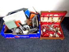 A box of assorted plated wares, boxed and unboxed cutlery, enamelled jug,