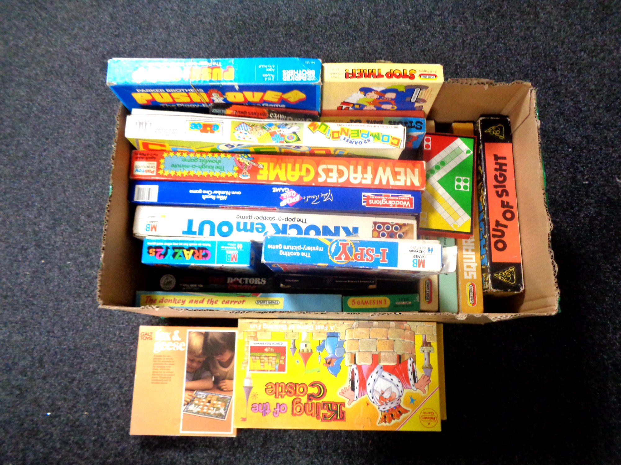 A box containing a quantity of vintage board games to include Pop Quiz Game, King of the Castle,
